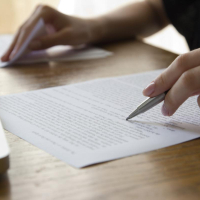Image of a person editing a manuscript